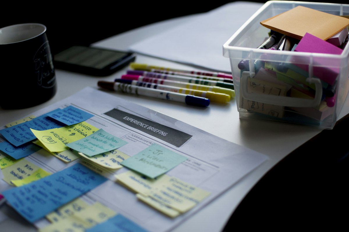 An organized desk with notes and planning materials showing AI summaries