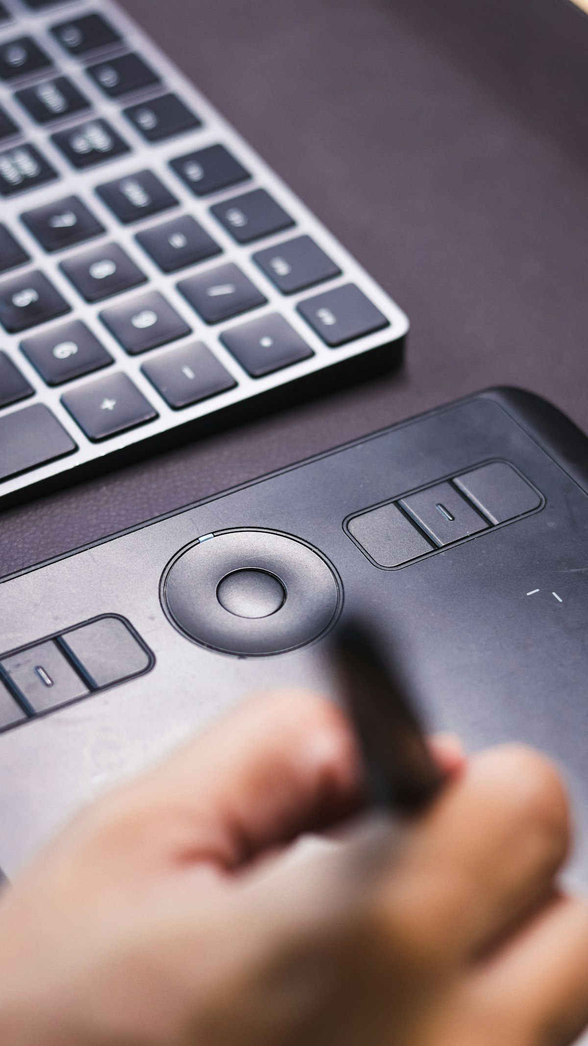 A designer working on graphics on screen using Canva Magic Studio