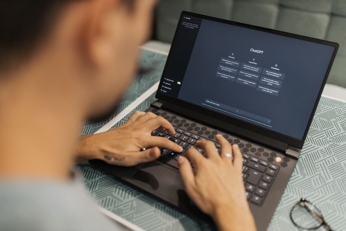 A founder working late on a laptop, using software tools to clear routine tasks