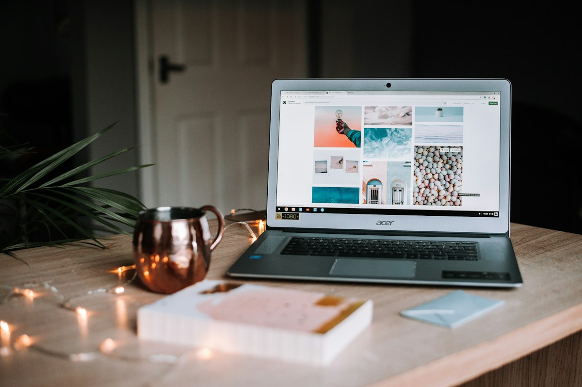 Hands typing on a laptop doing focused freelance writing work