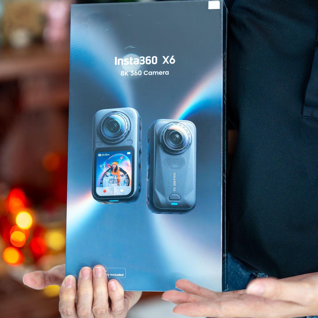 Person holding a product box up toward the camera